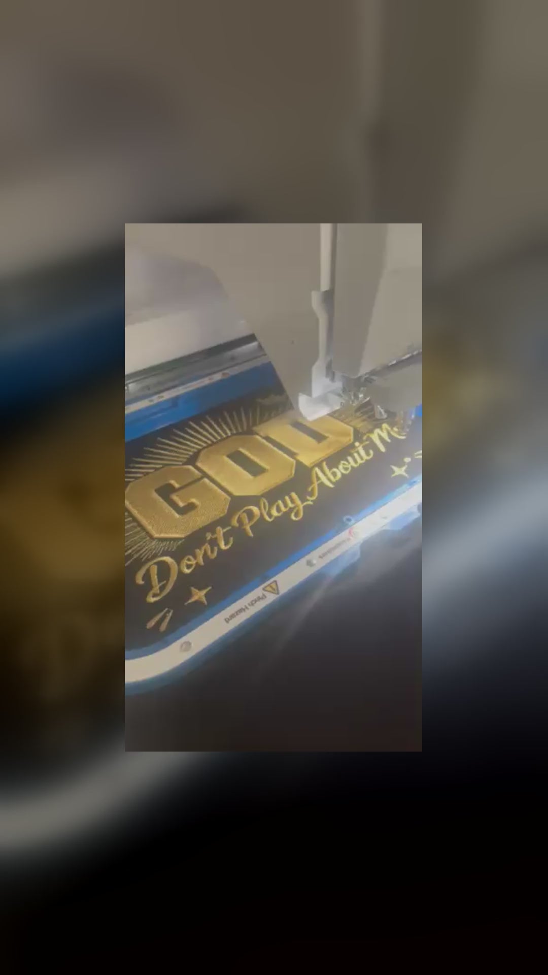 Load video: Jory's Hands custom embroidery process showing an embroidered apparel design being created.
